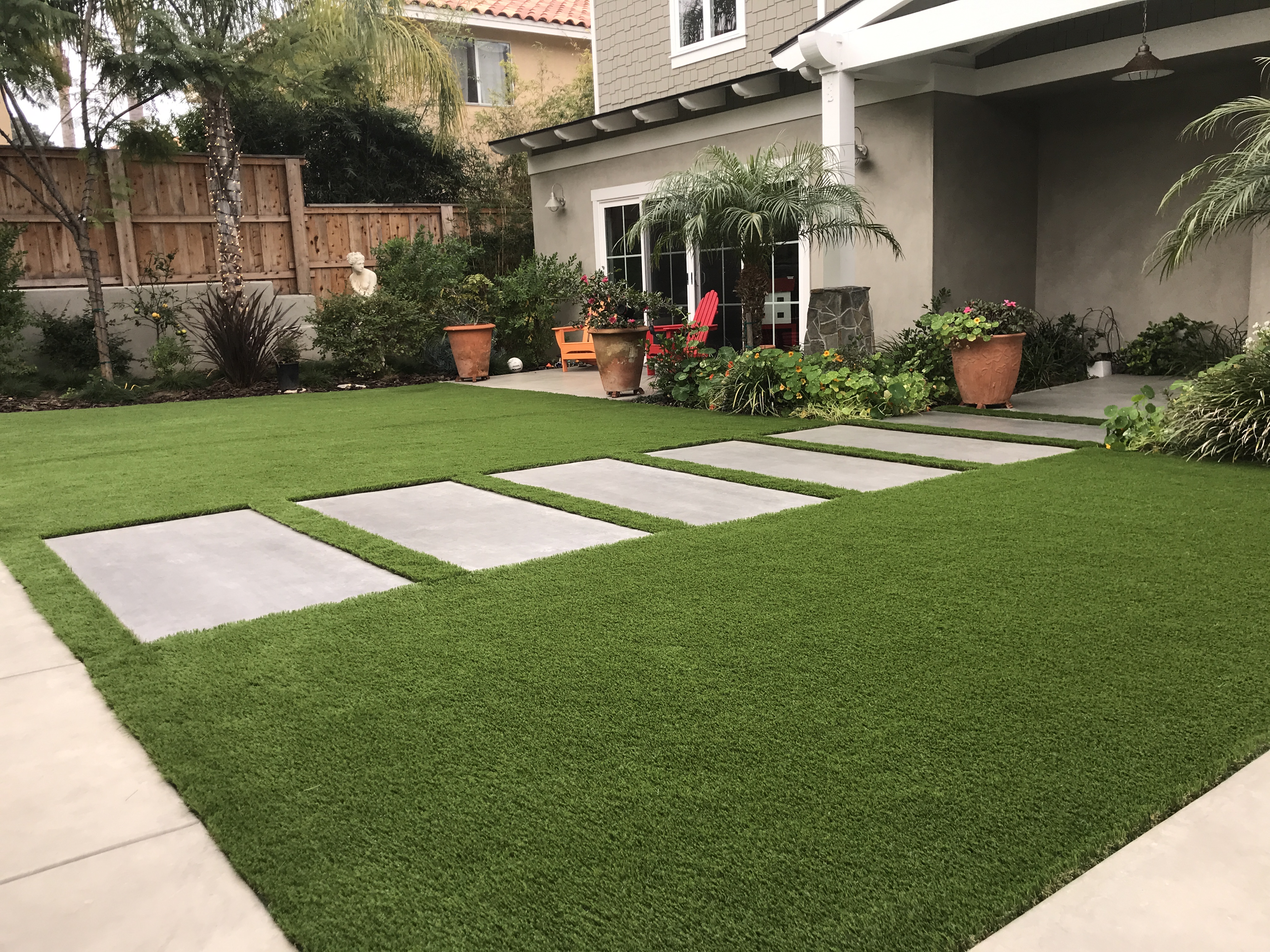 Artificial turf installation with modern pavers in San Diego