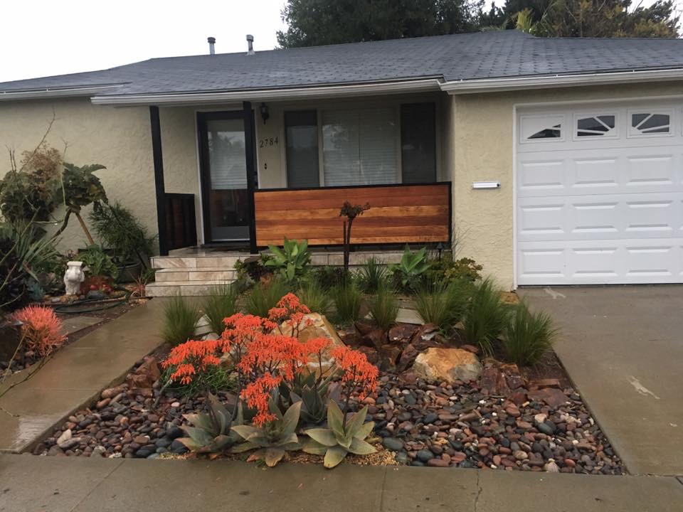 BBQ island mid-construction showing stone veneer and countertop installation