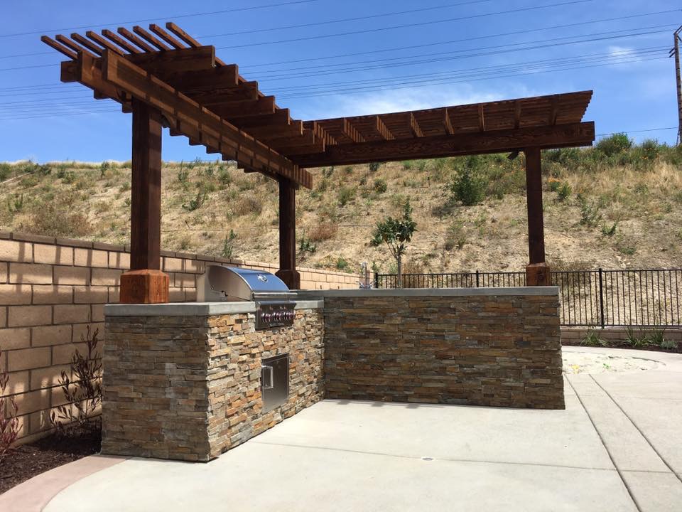 Custom pergola over stone patio