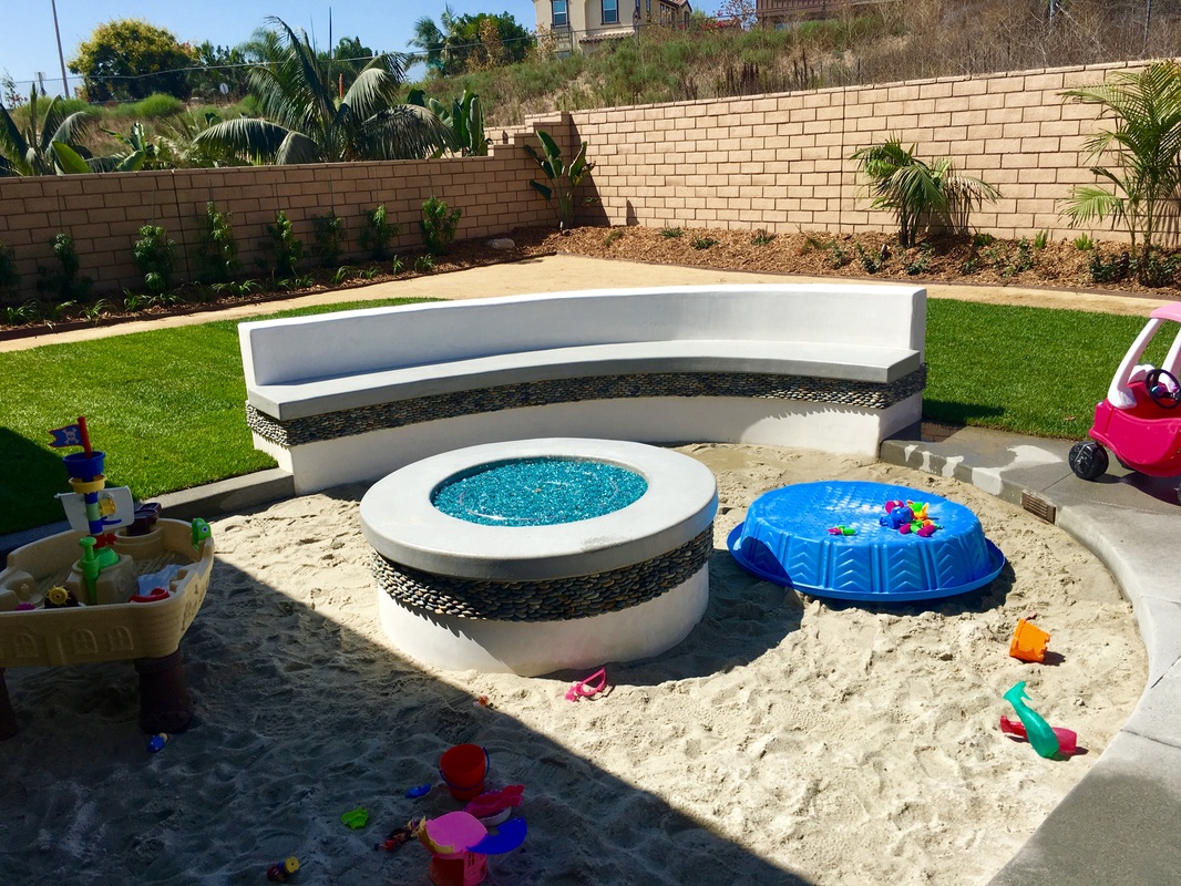 Built-in BBQ island with granite countertop and storage